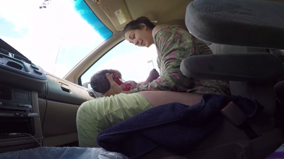 WARNING GRAPHIC VISUALS: Woman delivers baby in moving auto, husband