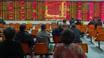 Wave of Chinese firms halt stock trading to avoid turmoil