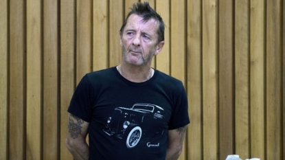 AC/DC drummer Rudd denies breaching detention by boozing