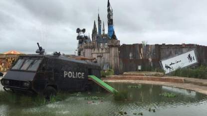 Artist Banksy opens derelict ‘Dismaland’ theme park