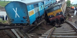 At least 21 dead after two trains derail in central India