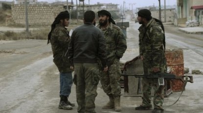 Syrian rebel group leaves their HQ after clash with al-Qaida