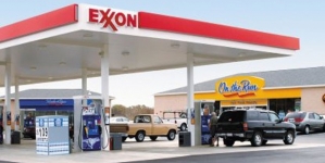 Exxon Mobil earnings fall 52 percent