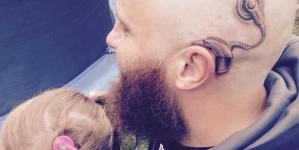 Dad gets matching tattoo of daughter’s cochlear implant