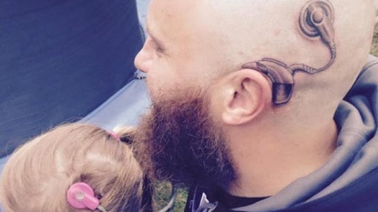 Dad gets matching tattoo of daughter’s cochlear implant