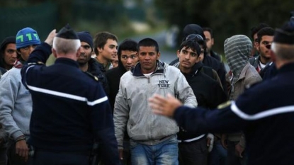 Migrants attempt to jump trains from France to Britain