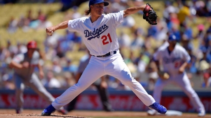 Greinke homers, lowers ERA to 1.58