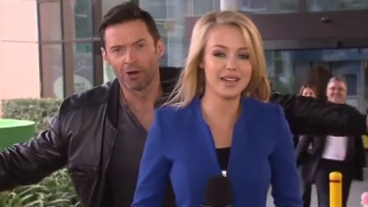 Hugh Jackman photobombs reporter on live television