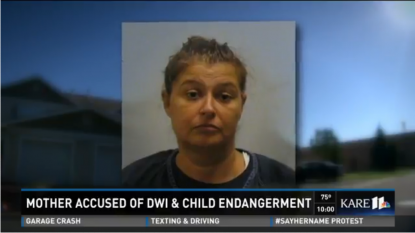 Charges: Mom drives off drunk with 8-year-old daughter hanging on to auto