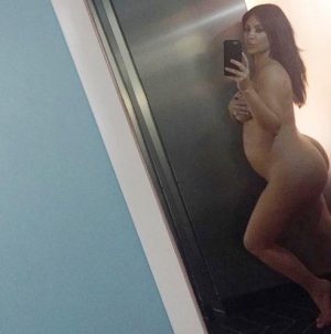 Kim Kardashian flaunts baby bump while exercising