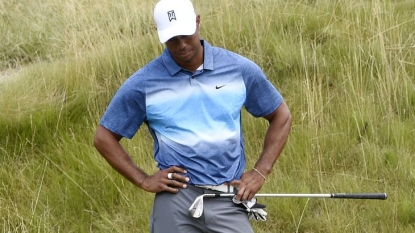 Tiger Woods and his teal hat shoot a 64 at the Wyndham