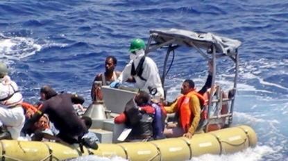 Sinking migrant boat poses desperate choices for father