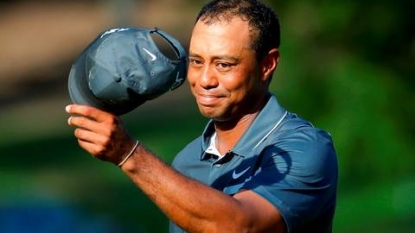 Tiger Woods is two shots back, fighting hard to continue season