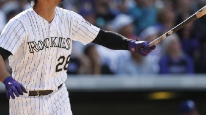 Arenado helps Rockies to 12-5 win over Dodgers