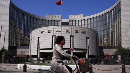 China’s yuan firms on stronger midpoint, Fed decision to hold rates