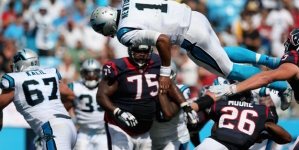 Cam Newton surprises 10-year-old cancer patient at Halloween party