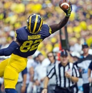 Michigan’s Smith hurts ankle, says he’ll play next week