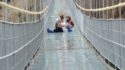 New Chinese glass suspension bridge that spans 180m-deep canyon is for fearless