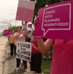 Planned Parenthood supporters rally outside U.S. Congressman’s office