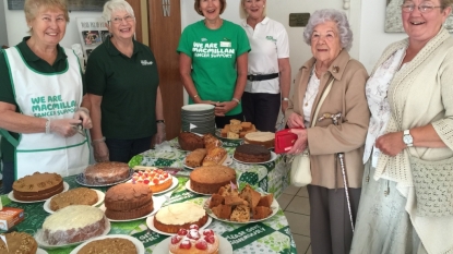 Charity gathering in Sutton Village Hall to help Macmillan Cancer Support and