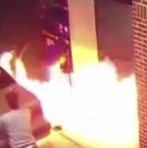 Motorist sets lighter to spider at gas station, burns pump