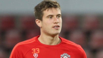 Manchester United defender Paddy McNair being assessed after abdominal injury