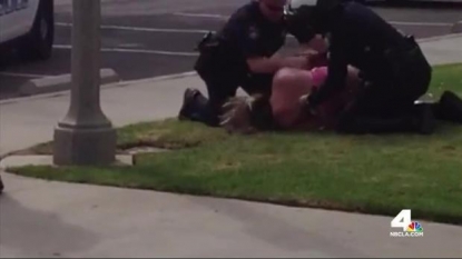 California woman files suit after video shows cops punching her