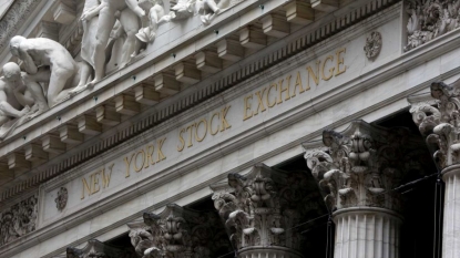 Stocks tick lower on mixed earnings; price of oil skids