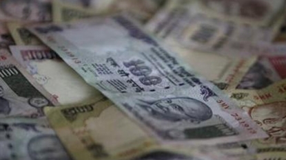 Rupee pares a few early gains, up 4 paise against dollar