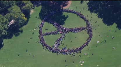 2000 form human peace sign to honor John Lennon in NYC