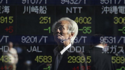 Asian shares mixed on Fed comments