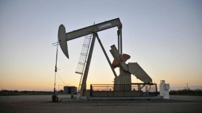 Oil edges up, but signs point to growing glut of barrels