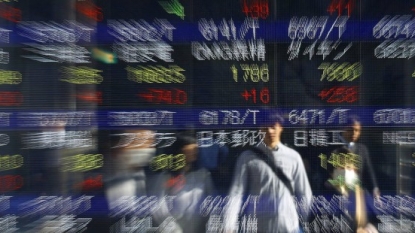 Japan Post share prices surge on market debut