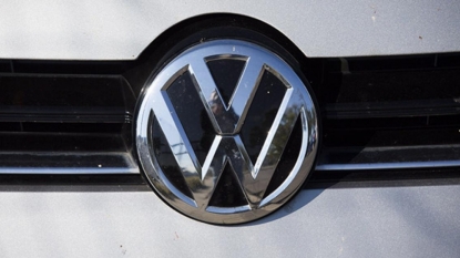 Volkswagen slashes spending amid emissions scandal