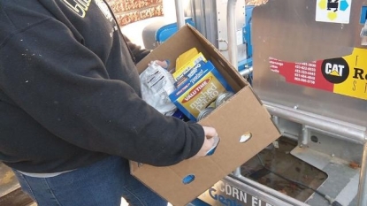 Volunteers help pack thousands of Thanksgiving dinners at Raleigh food bank