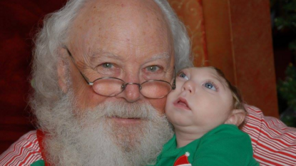 Holiday miracle: Baby with partially developed brain pays a visit to Santa