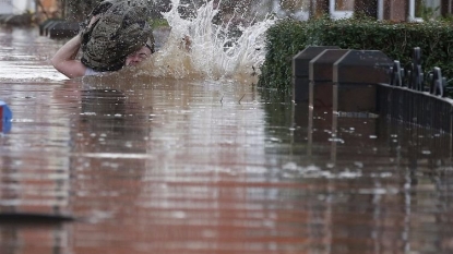 Thousands hit by floods in Britain, PM Cameron calls emergency meet