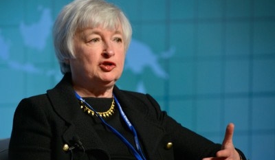 Fed keeps rates steady but sees less risk to US economy