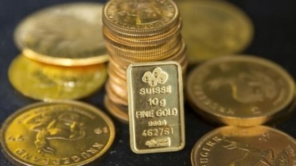 Gold flat on firmer dollar; seen range-bound