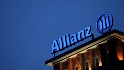 Allianz Q2 net falls by half, hit by claims, unit sale