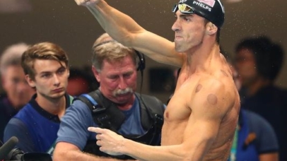 Michael Phelps safely into 100m butterfly final