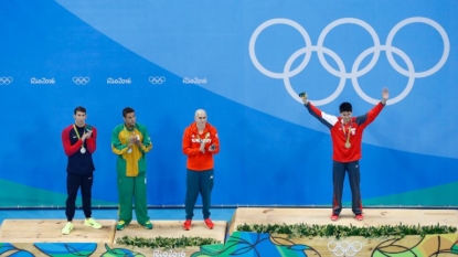 Phelps beaten as Singapore wins first gold