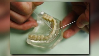 Report questions benefits of dental floss