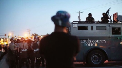 Driver slams into Ferguson protester