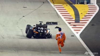 A marshal on track, plus other top shots from the Singapore GP