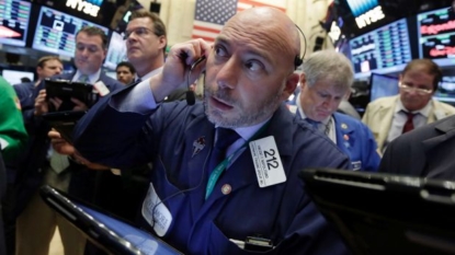 Global stocks mixed pending US, Japan central bank meetings