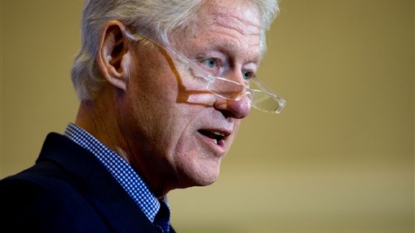 Bill Clinton, back on the trail, defends Clinton Foundation