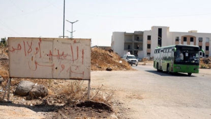 Aid arrives at besieged rebel-held Syrian suburb