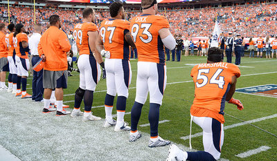 Broncos NFL player kneels during U.S. anthem