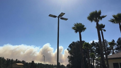 Crews halt growth of California base wildfire